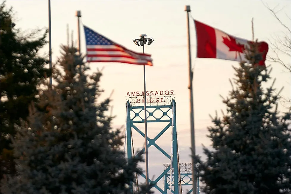 American and Canadian flags at the border in Ontario, Canada