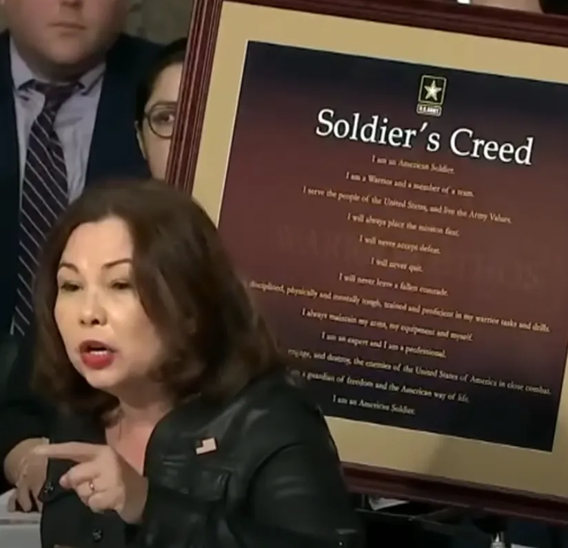 Senator Duckworth in front of Soldiers Creed