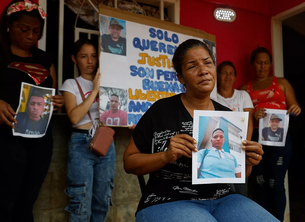 family with photos of deportees