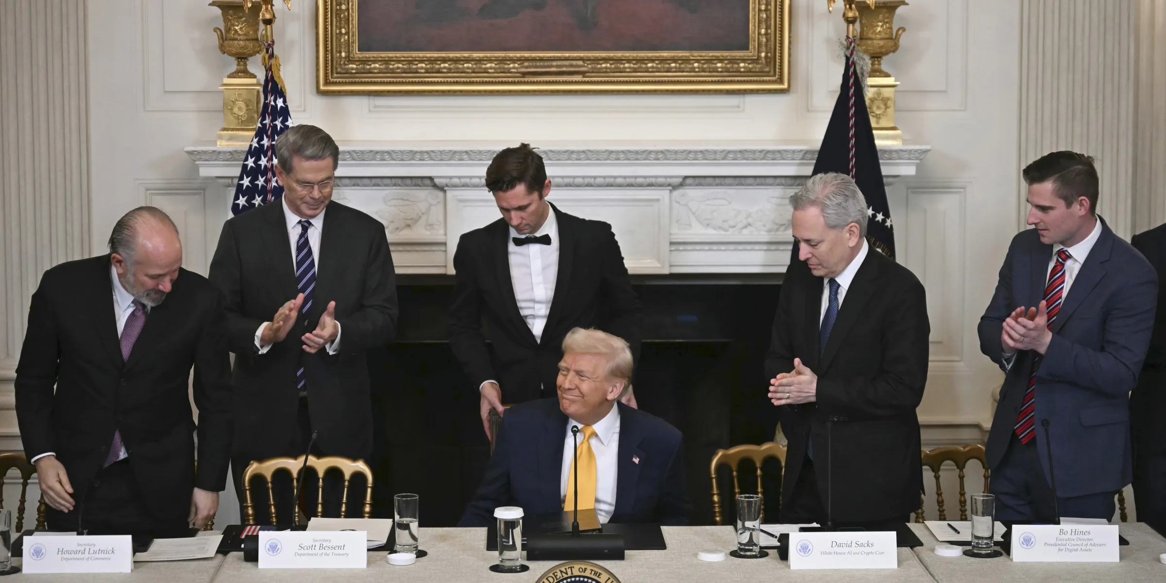 Donald Trump sits during the White House Crypto Summit in Washington, D.C., on March 7, 2025