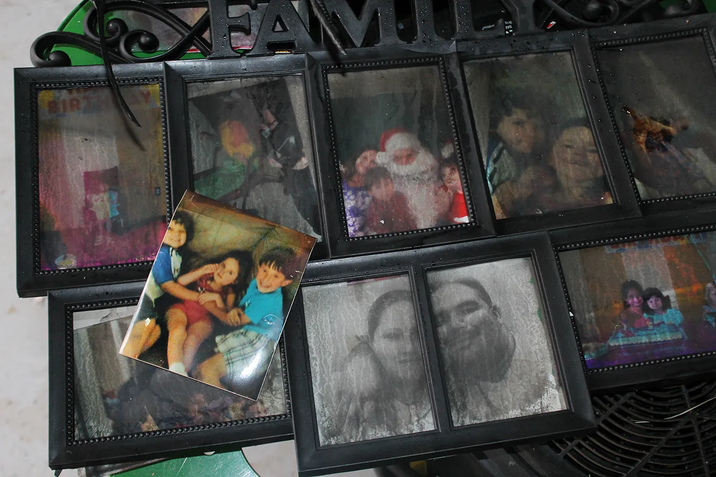Family photographs belonging to the Taylor family, shown after the fire at 1041 Lee St. in St. Augustine, Fl