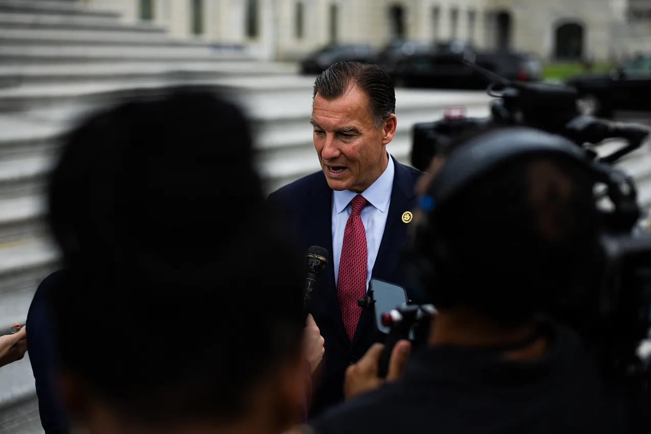 Suozzi talks to reporters outside the Capitol last summer