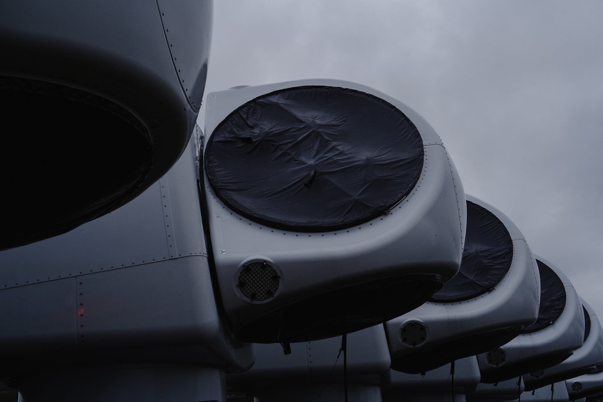 Nacelles, the large chambers at the top of wind turbines, outside a factory operated by Vestas, a leading wind turbine maker, in Odense, Denmark