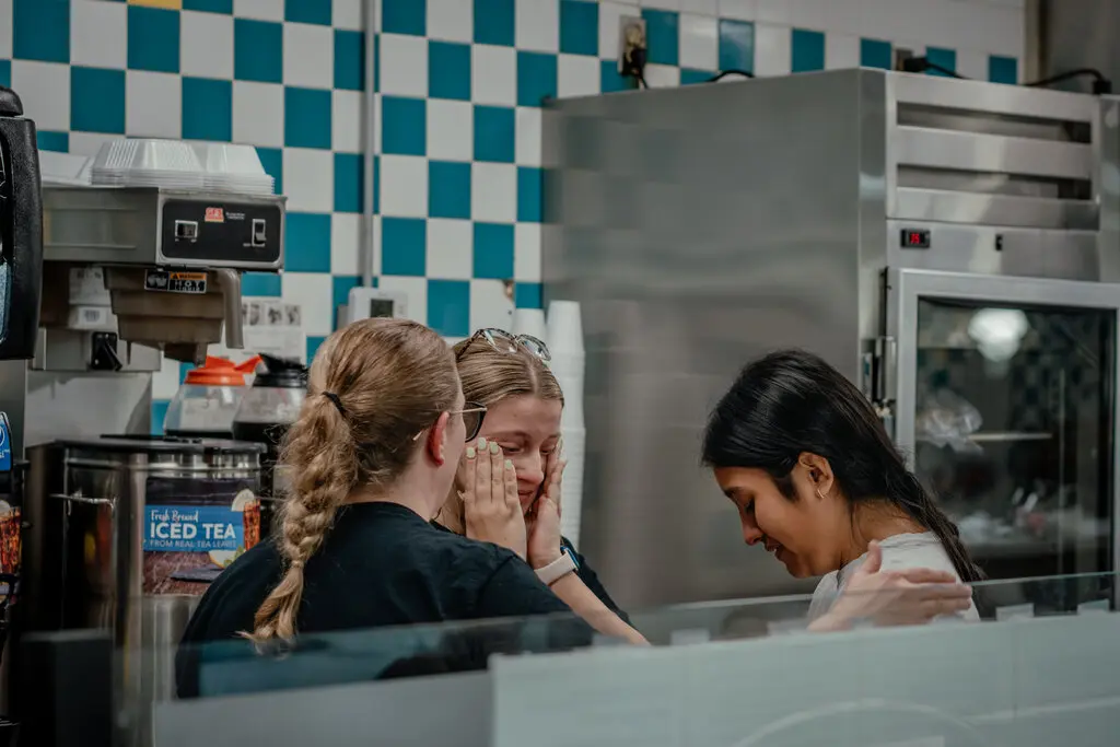 Restaurant employees in Kennett, Mo., after seeing a co-worker during a video meeting from where she was held in immigration detention in May.Credit...Jamie Kelter Davis for The New York Times