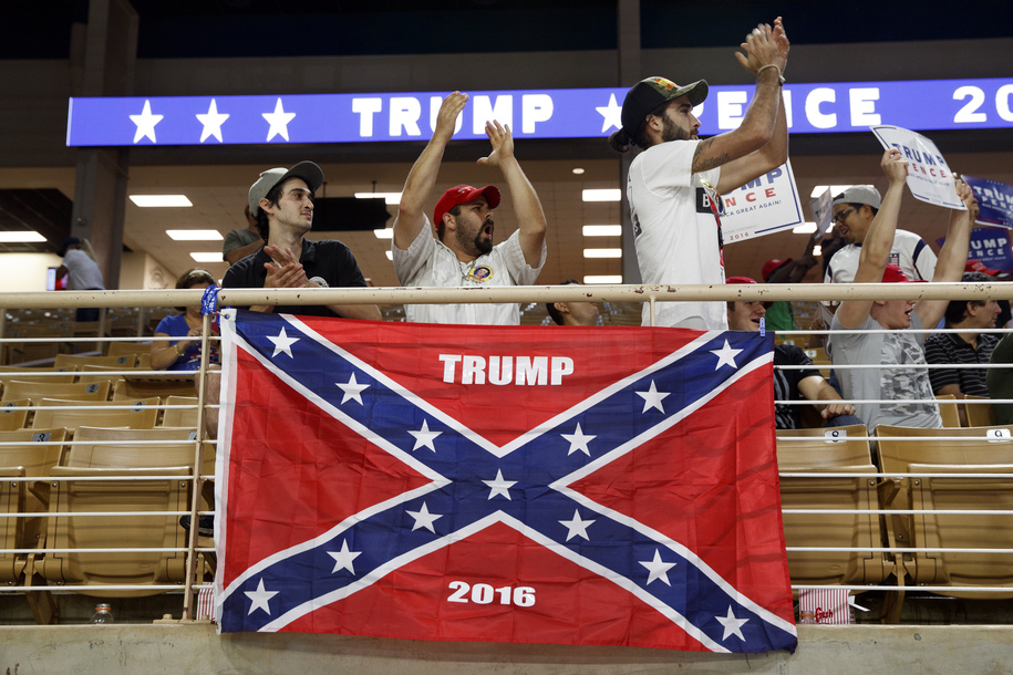Brandon Miles, left, Brandon Partin, center, and Michael Miles, right, cheer during a rally for Republican presidential candidate Donald Trump on Aug. 11, 2016, in Kissimmee, Florida.