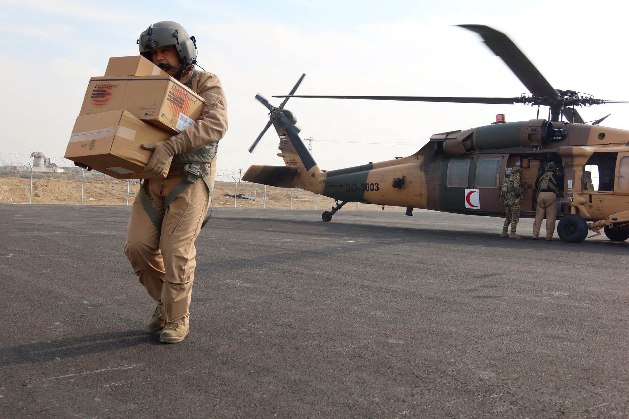 A member of the Jordanian air forces unloads aid during a ceasefire at Kissufim Crossing — January 28, 2025 | REUTERS/Jehad Shelbak REFILE A member of the Jordanian air forces unloads aid during a ceasefire at Kissufim Crossing — January 28, 2025 | REUTERS/Jehad Shelbak REFILE