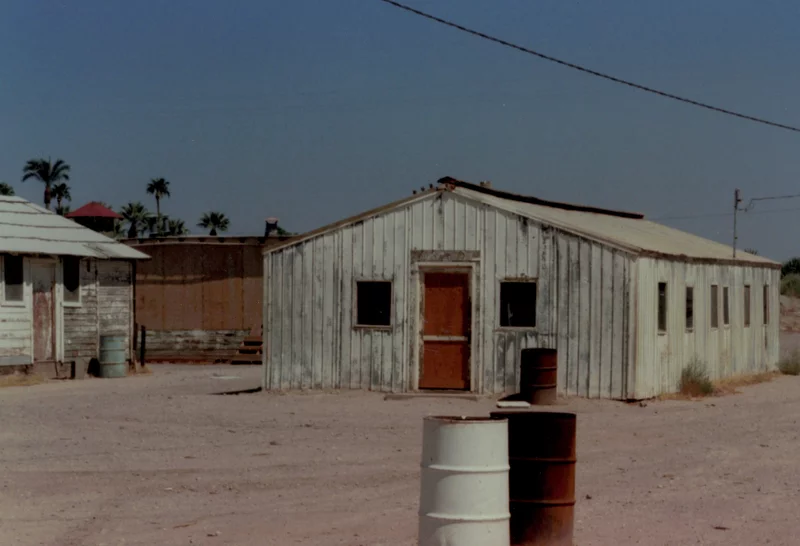 An exterior view of the barracks where Carter and his classmates lived for the summer, pictured in 1992. Carter says even in 1965, the housing was dilapidated. The University High crew worked six days a week, with Sundays off, and they were not allowed to return home during their stint. Randy Carter