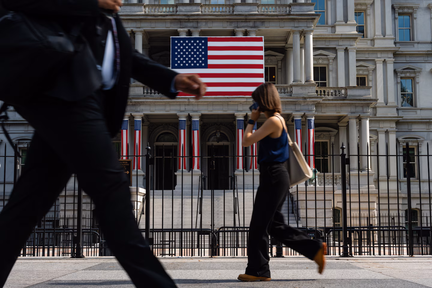 People outside the Eisenhower Executive Office Building in Washington on July 15. (Eric Lee/For The Washington Post)