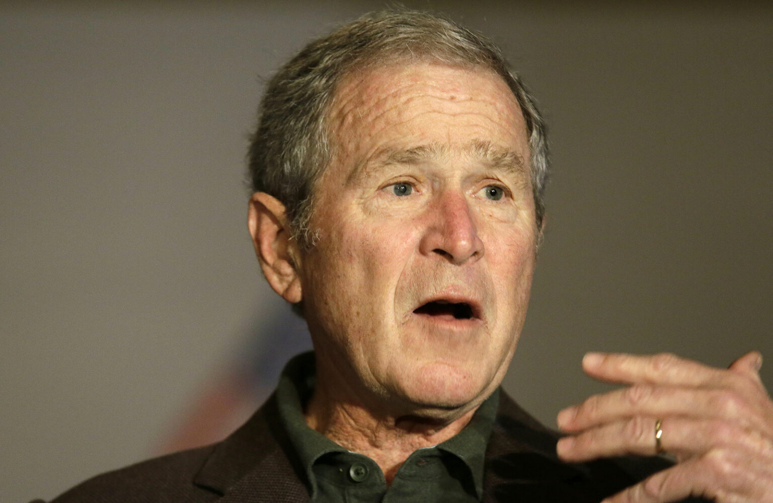 Former President George W. Bush speaks during a preview of an exhibition of his paintings in Dallas, Feb. 28, 2017. (AP Photo/LM Otero)