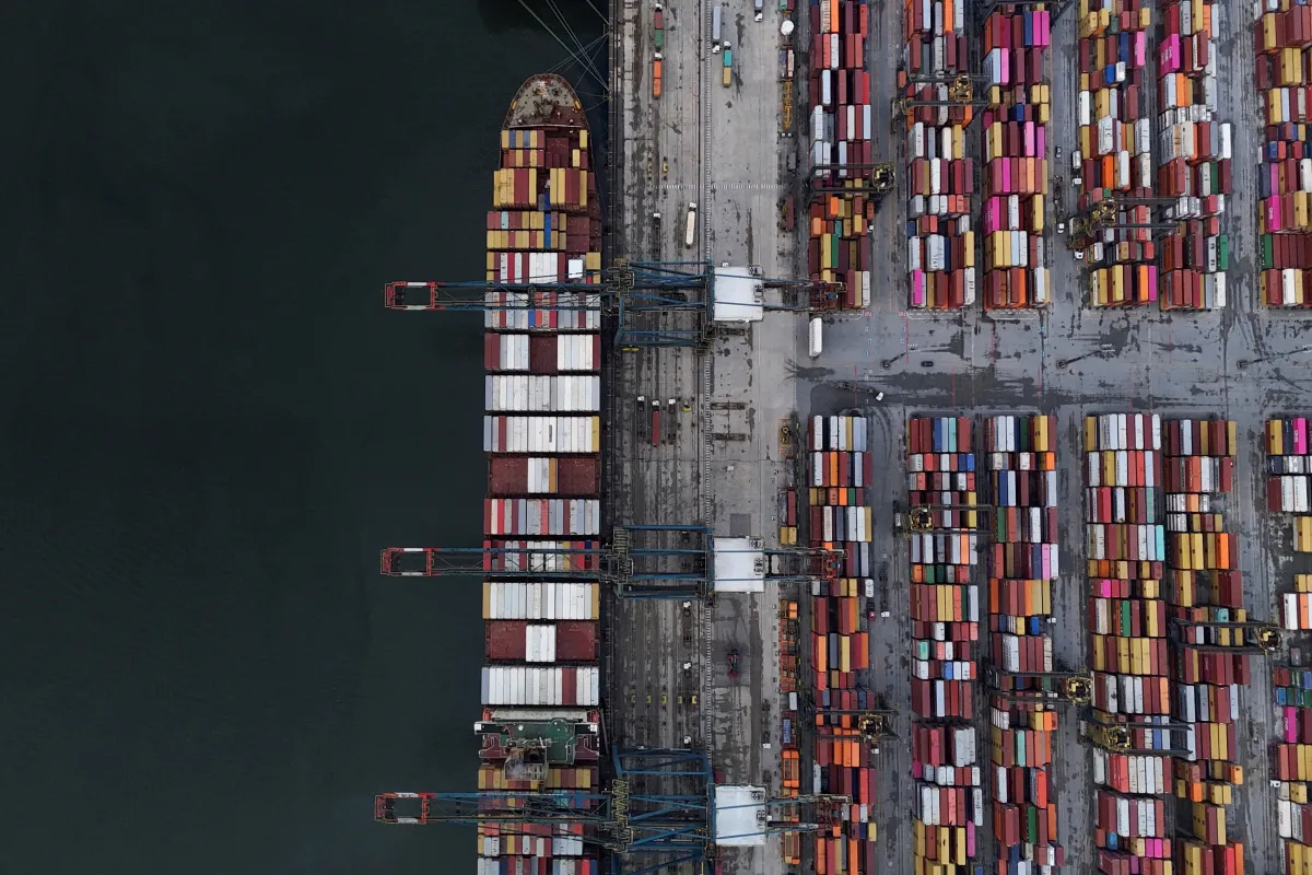 A ship and containers at a port in Santos, Brazil, April 2025 Amanda Perobelli / Reuters