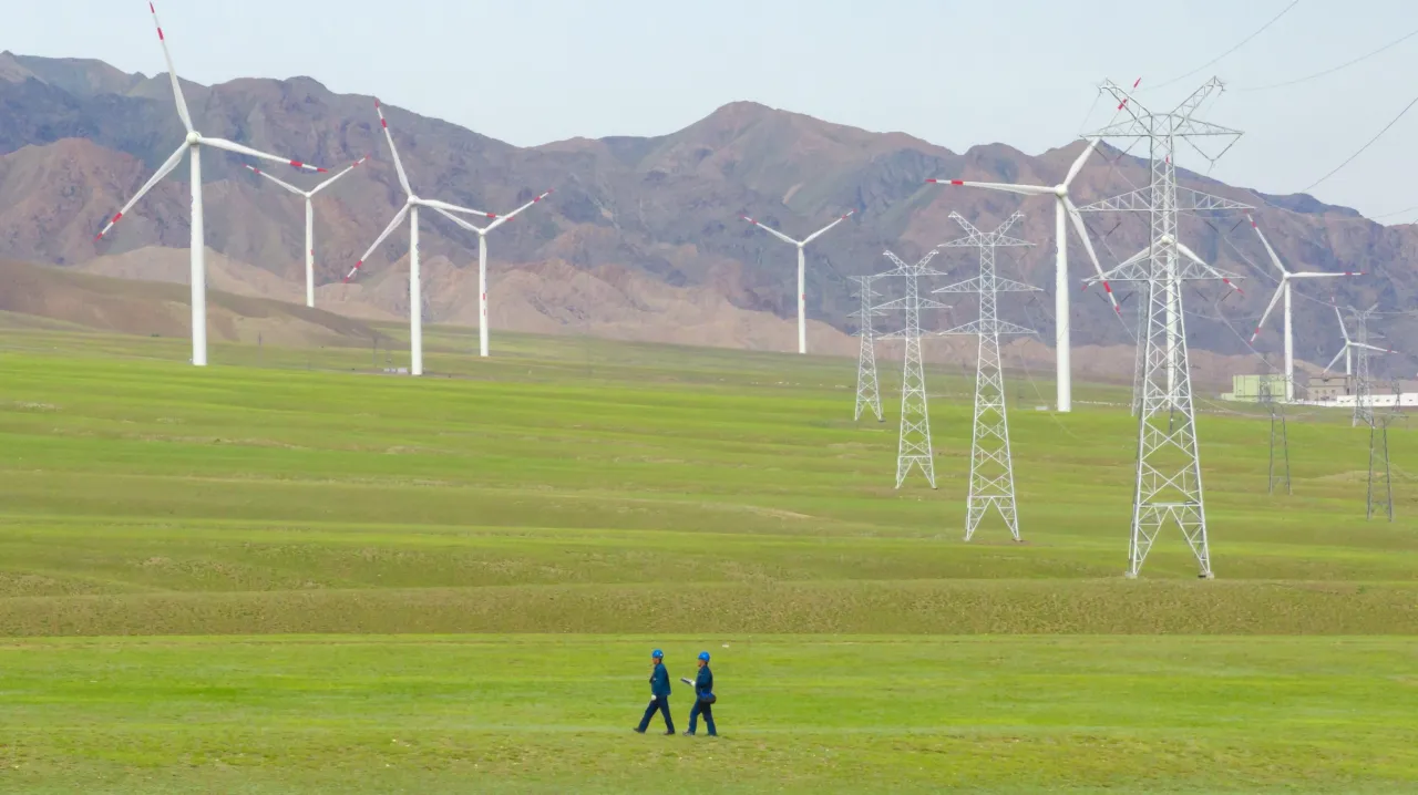 A drone photo shows staff members of State Grid Bortala Electric Power Supply Company patrolling near Sayram Lake scenic area to ensure power supply in Bortala Mongolian Autonomous Prefecture, northwest China's Xinjiang Uygur Autonomous Region, July 17, 2025.Yin Tianjie/Xinhua via Getty Images