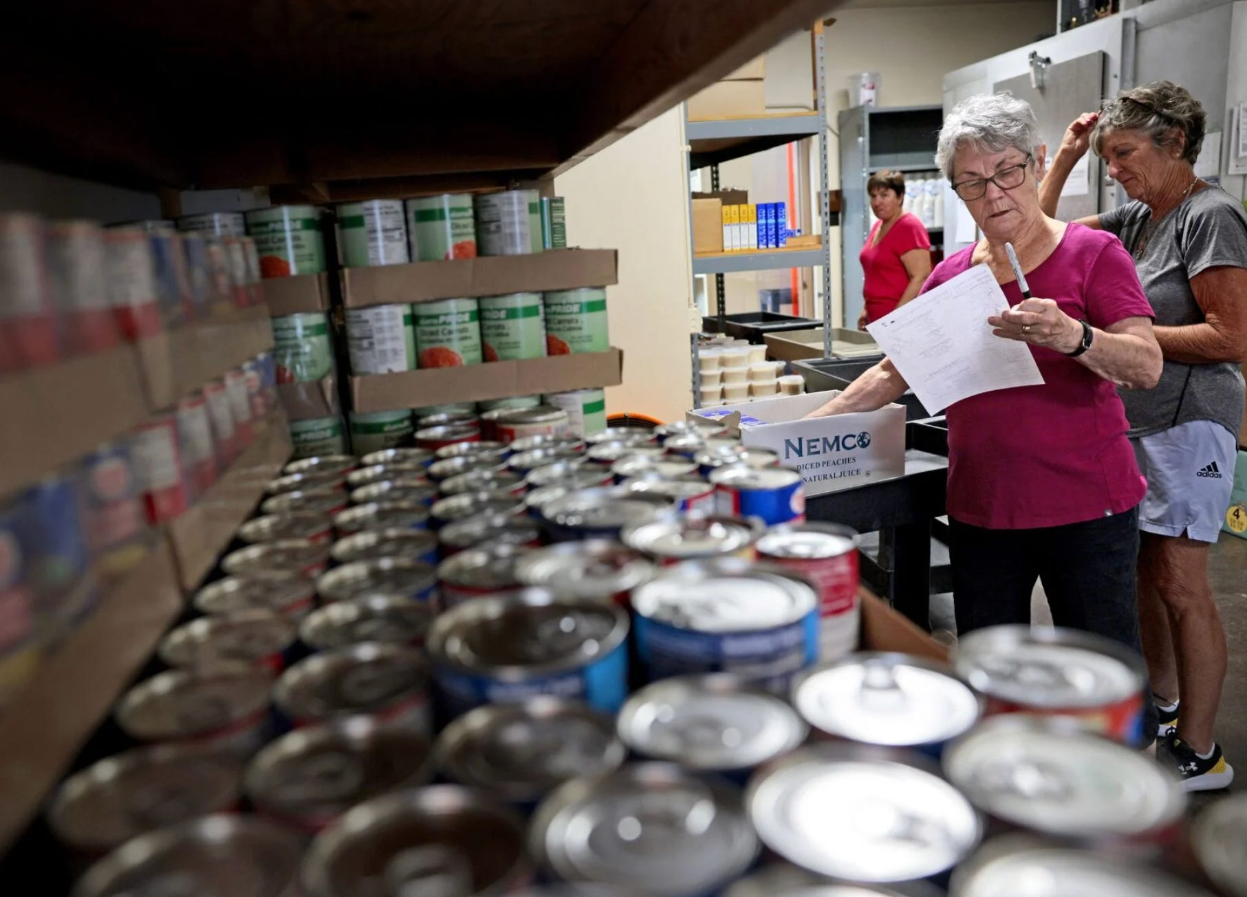 Cathy Vander Pluym, a volunteer at the St. Augustine Wellston Center food pantry, uses a list to put together a box of food intended to last one month for a family of seven, on Friday, Aug. 15, 2025. - Christian Gooden, Post-Dispatch Cathy Vander Pluym, a volunteer at the St. Augustine Wellston Center food pantry, uses a list to put together a box of food intended to last one month for a family of seven, on Friday, Aug. 15, 2025. - Christian Gooden, Post-Dispatch
