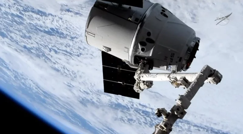 A robotic arm attached to the International Space Station brings in the spacecraft carrying one of two Orbiting Carbon Observatory instruments, known as OCO-3, in 2019. NASA has put out a call for private groups to potentially take over the cost of maintaining the instrument, which measures carbon dioxide in Earth's atmosphere. NASA TV/NASA A robotic arm attached to the International Space Station brings in the spacecraft carrying one of two Orbiting Carbon Observatory instruments, known as OCO-3, in 2019. NASA has put out a call for private groups to potentially take over the cost of maintaining the instrument, which measures carbon dioxide in Earth's atmosphere. NASA TV/NASA