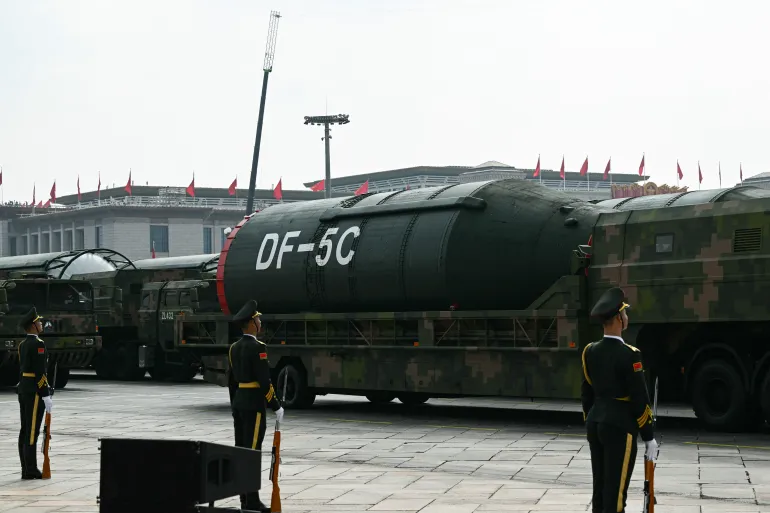 DF-5C intercontinental ballistic missiles are displayed during a military parade in Beijing's Tiananmen Square on September 3, 2025 [Greg Baker/AFP]