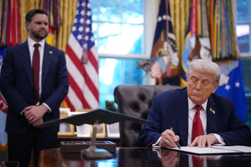 Vice President Vance looks on as President Trump signs an executive order in the Oval Office on Thursday in Washington, D.C. Trump signed an order approving a partial sale of TikTok's U.S. operations, following a 2024 law requiring parent company ByteDance to divest or face a ban.Andrew Harnik/Getty Images