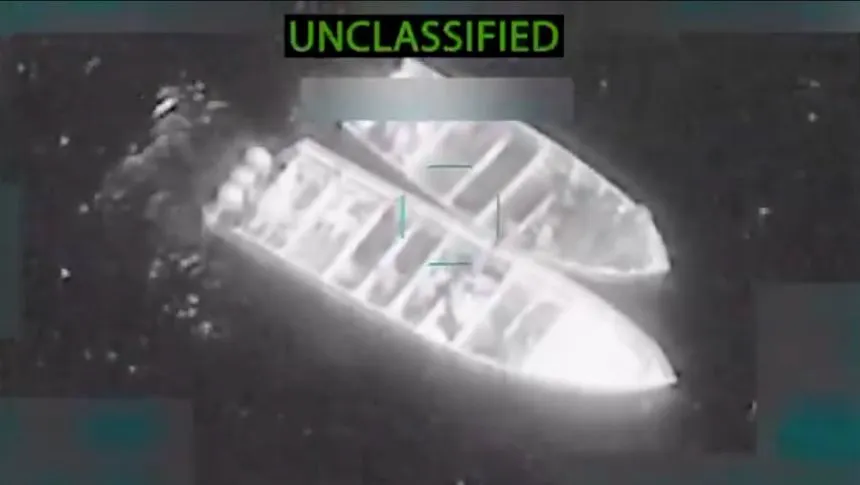 Still from video of boats with thwarts and black-wrapped packages