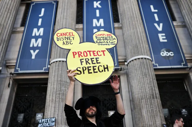 A demonstrator waves a "Protect Free Speech" sign at a protest on Sept. 22, 2025, in Los Angeles against the suspension of the "Jimmy Kimmel Live!" show, held near the theater where the show is produced in Hollywood.
