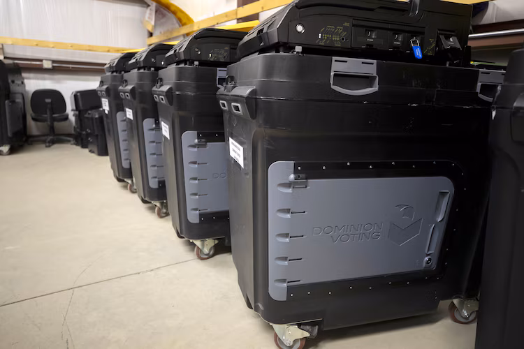 Dominion Voting Systems ballot-counting machines are lined up at a Torrance County warehouse during testing of election equipment with local candidates and partisan officers in Estancia, N.M., Sept. 29, 2022.Andres Leighton/AP