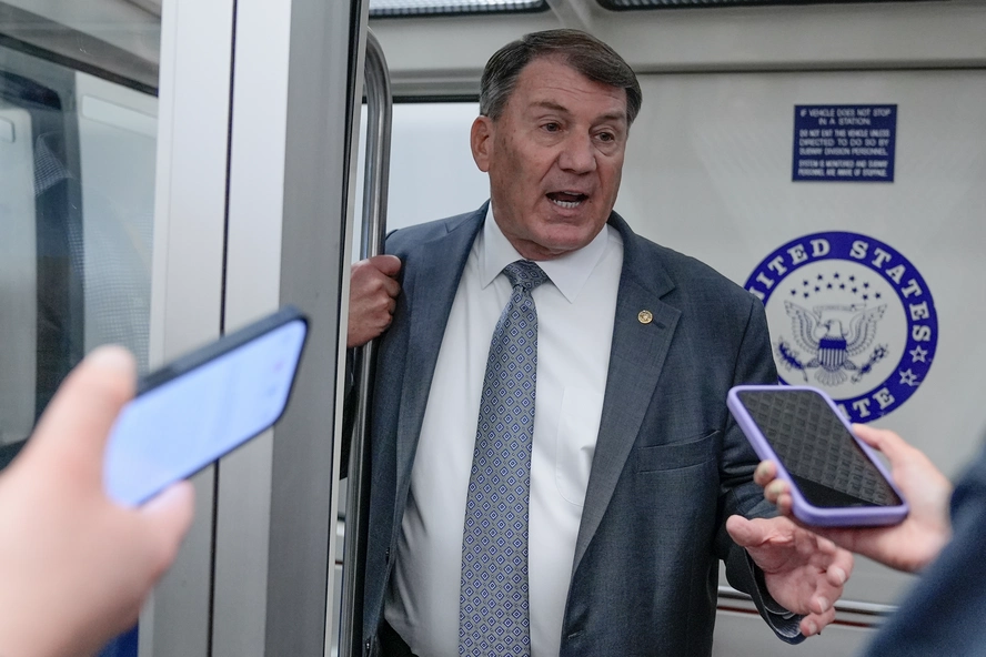 Sen. Mike Rounds speaks with reporters on the Capitol subway on Nov. 20, 2025. | Mariam Zuhaib/AP