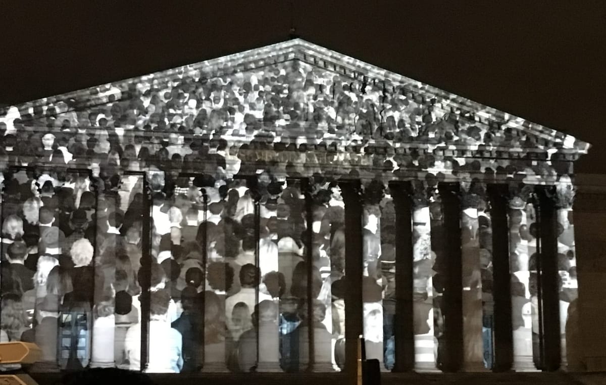 Projection by Darren Aronofsky on a public building at the Paris Climate Treaty conference, 2015. 