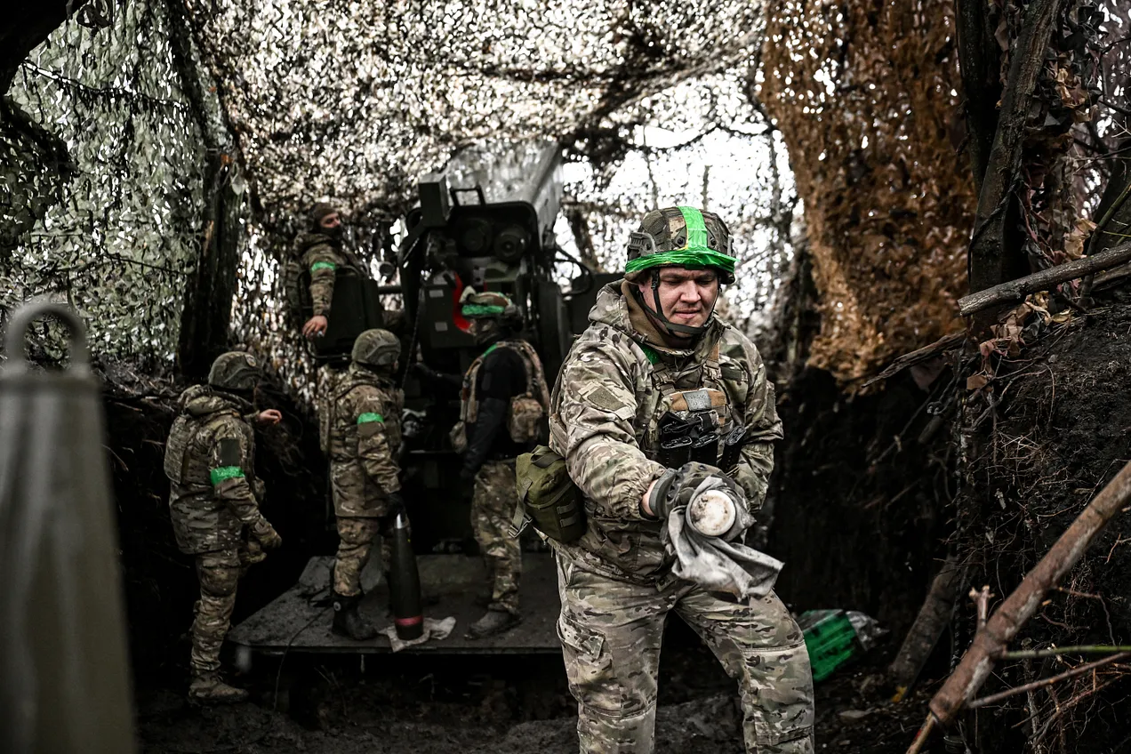 Soldiers from a Ukrainian artillery crew prepare to fire a 2S22 Bohdana 155mm self-propelled howitzer at the positions of Russian troops around Pokrovsk on November 20, 2025. (Photo by Dmytro Smolienko / Ukrinform / NurPhoto via Getty Images)