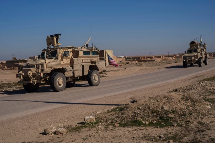 A U.S. military convoy drives along a road in northeastern Syria’s Hasakeh province, Thursday, Jan. 30, 2025. (AP Photo/Bernat Armangue, File)