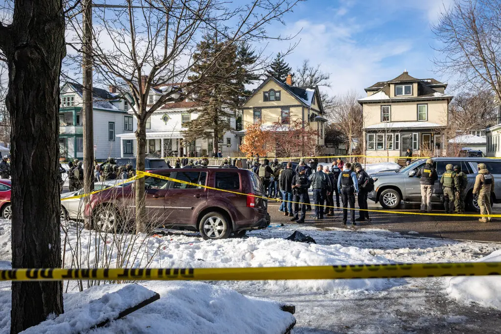 Police taped off a maroon S.U.V. vehicle in which Renee Good was shot by a federal agent in south Minneapolis on Wednesday.Credit...David Guttenfelder/The New York Times