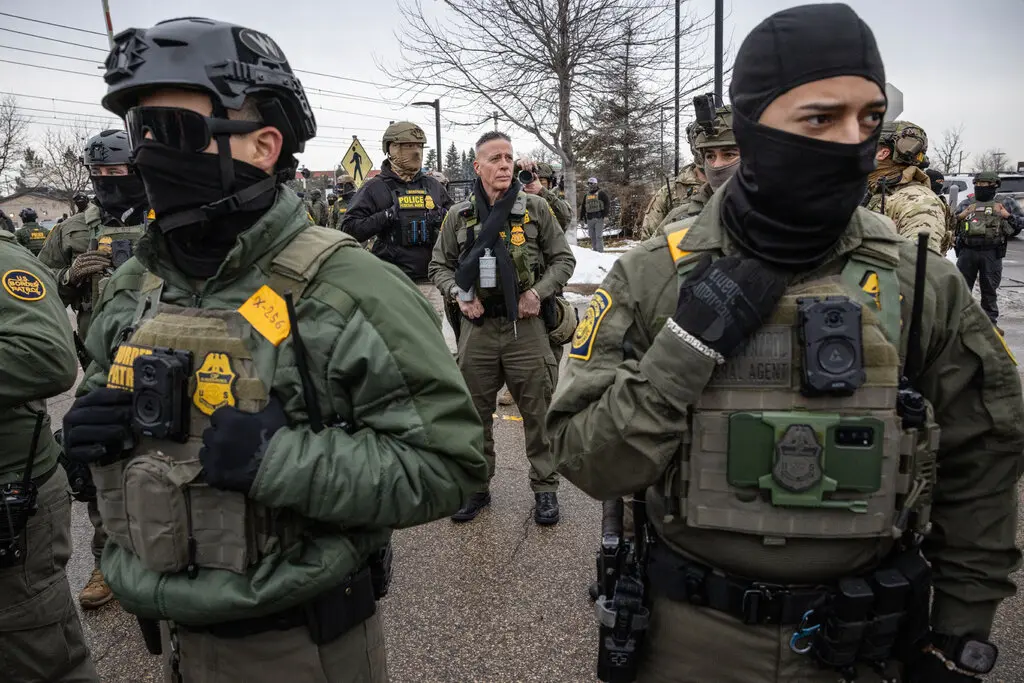 Gregory Bovino, center, has become the face of the Trump administration’s aggressive immigration enforcement tactics.Credit...David Guttenfelder/The New York Times