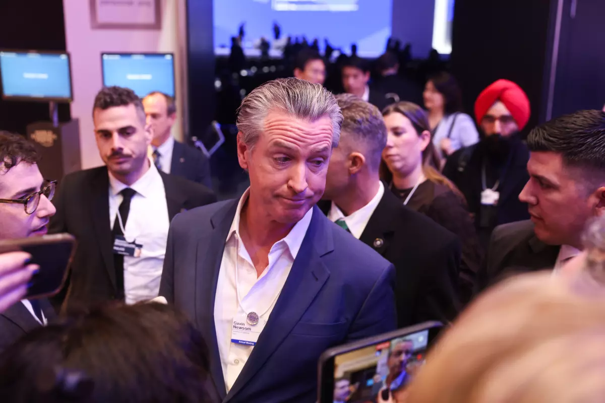 Gov. Gavin Newsom speaks to members of the media Tuesday during the World Economic Forum in Davos, Switzerland. (Bloomberg / Getty Images)
