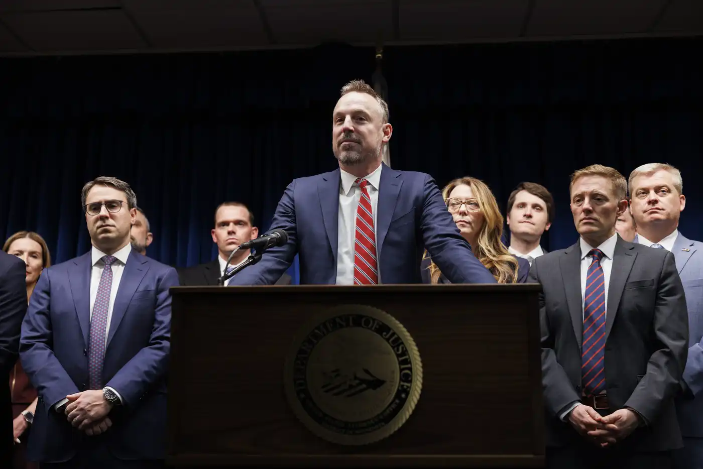 Assistant U.S. Attorney Joe Thompson (center) answers questions during a press conference at the Minneapolis federal courthouse, addressing developments in the Feeding Our Future fraud case.Kerem Yücel | MPR News 2025