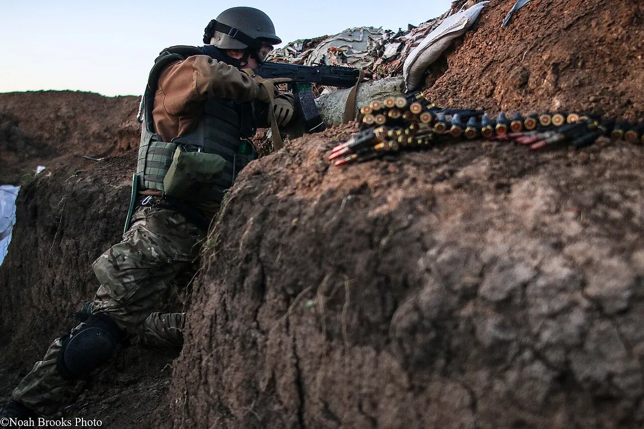 A Ukrainian soldier holds the line