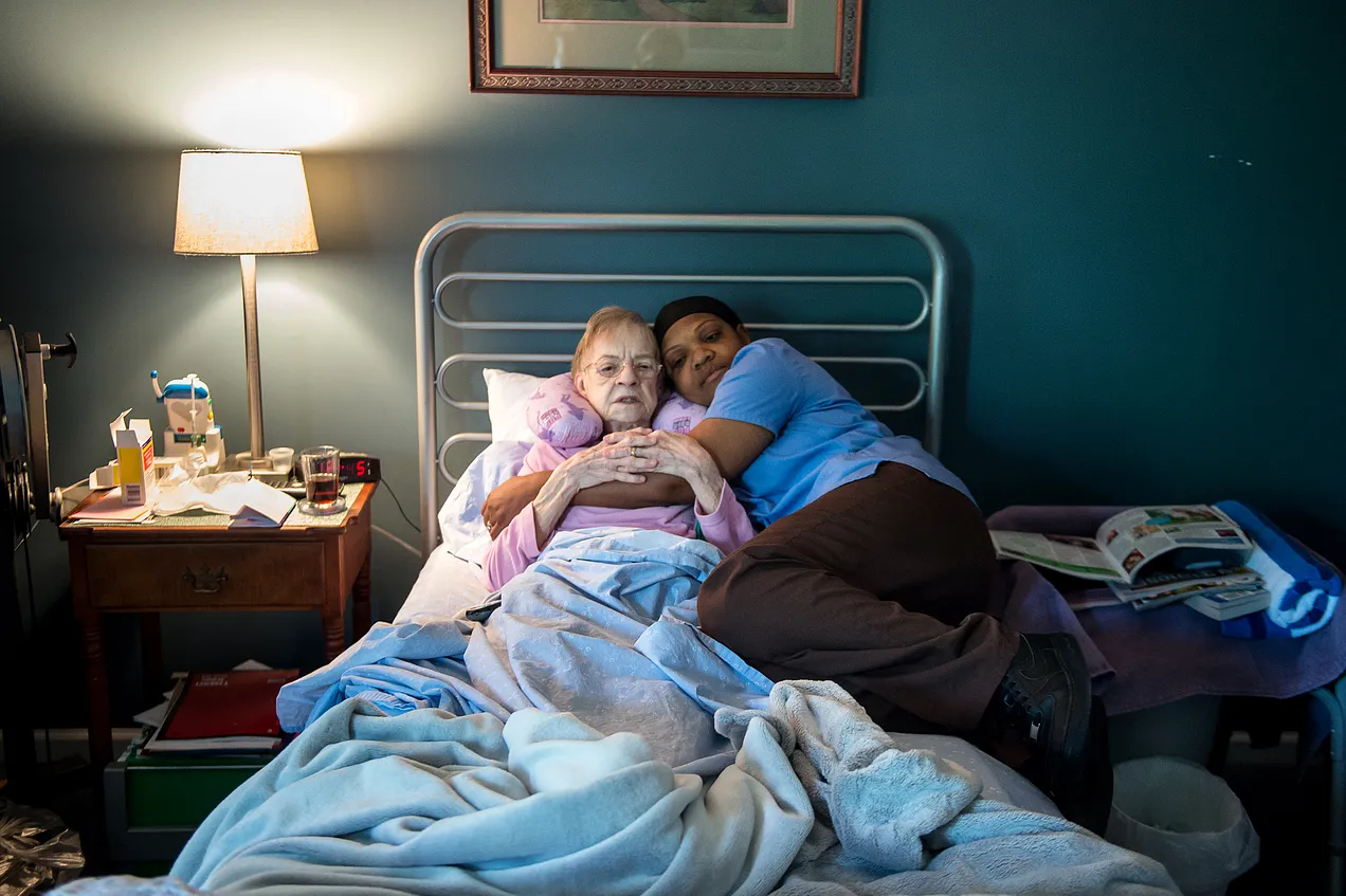 A hospice patient and her home care aide in 2016. (Photo by Susan L. Angstadt / MediaNews Group / Reading Eagle via Getty Images)