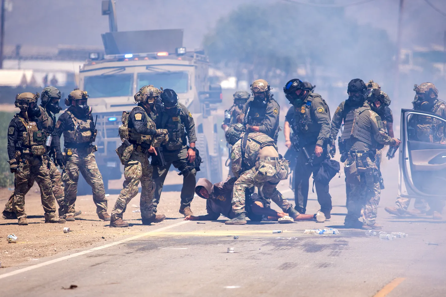 The author being detained by federal agents on July 10 : Credit- Blake Fagan via AFP