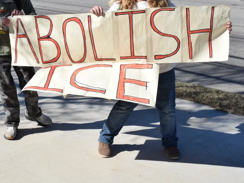 Students hold a sign during the Anti-ICE walkout on Feb. 6Credit: Sammie Seamon
