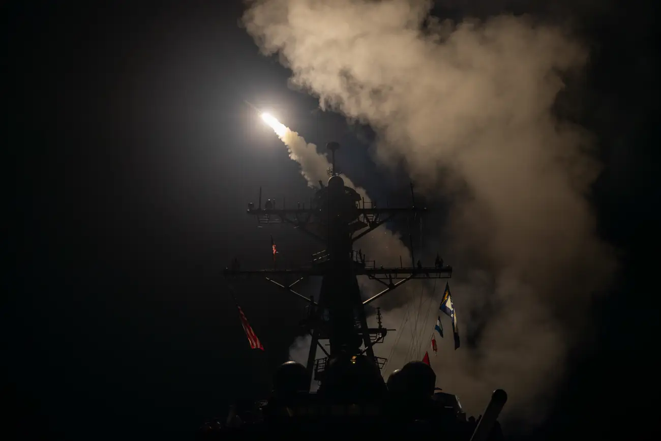 A missile being launched from a ship at night.Tomahawk cruise missiles were part of the strike package launched against Iran during 