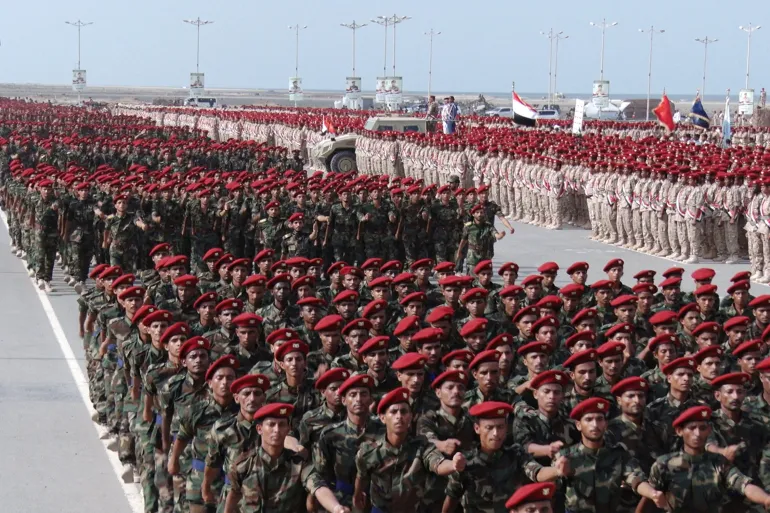 Houthi forces march in the Red Sea port city of Hodeidah Houthi forces march in the Red Sea port city of Hodeidah
