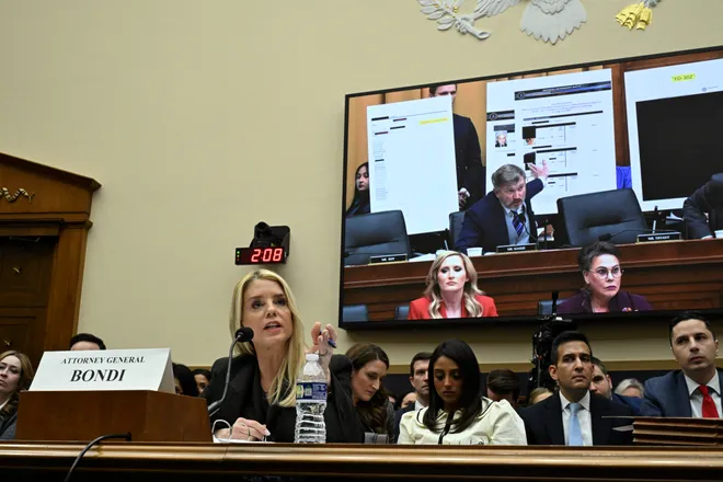 Attorney General Pam Bondi speaks with Rep. Thomas Massie, R-Kentucky, as she testifies before a House Judiciary Committee hearing on "Oversight of the Department of Justice" on Capitol Hill in Washington, DC, on Feb. 11, 2026. ROBERTO SCHMIDT, AFP Via Getty Images
