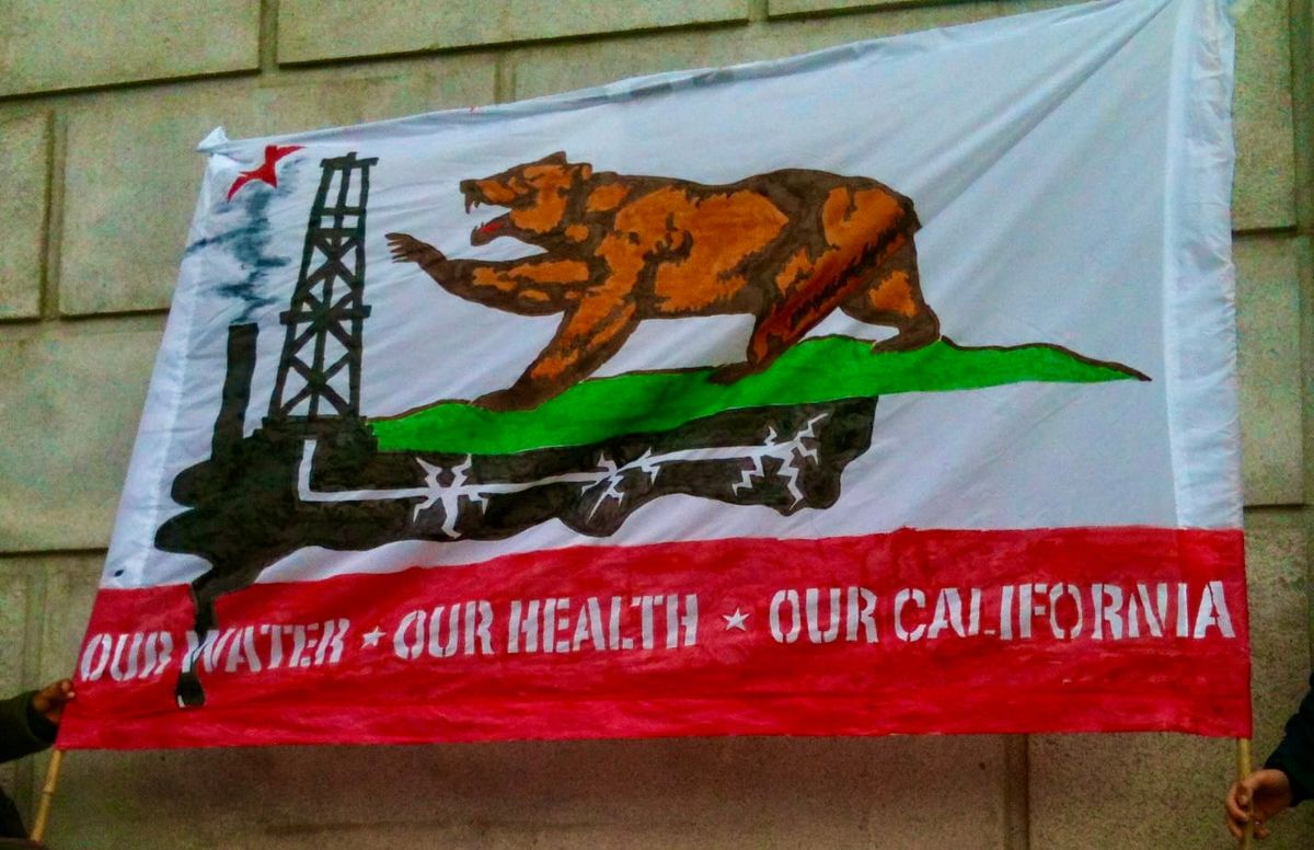 2015 anti-fracking California flag at a climate protest in San Francisco