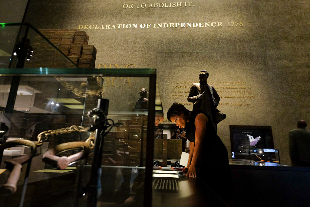 A rough draft of the Declaration of Independence behind save shackles during the grand opening of the Smithsonian Institution's National Museum of African American History and Culture on September 24, 2016, in Washington, D.C.Jahi Chikwendiu / The Washington Post via Getty Images