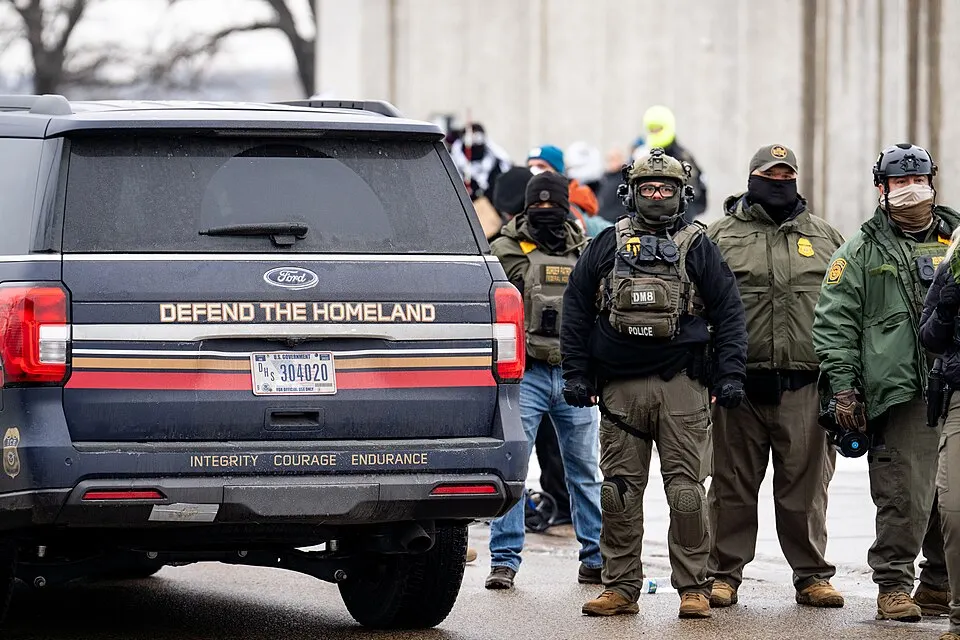 ICE vehicle and officers