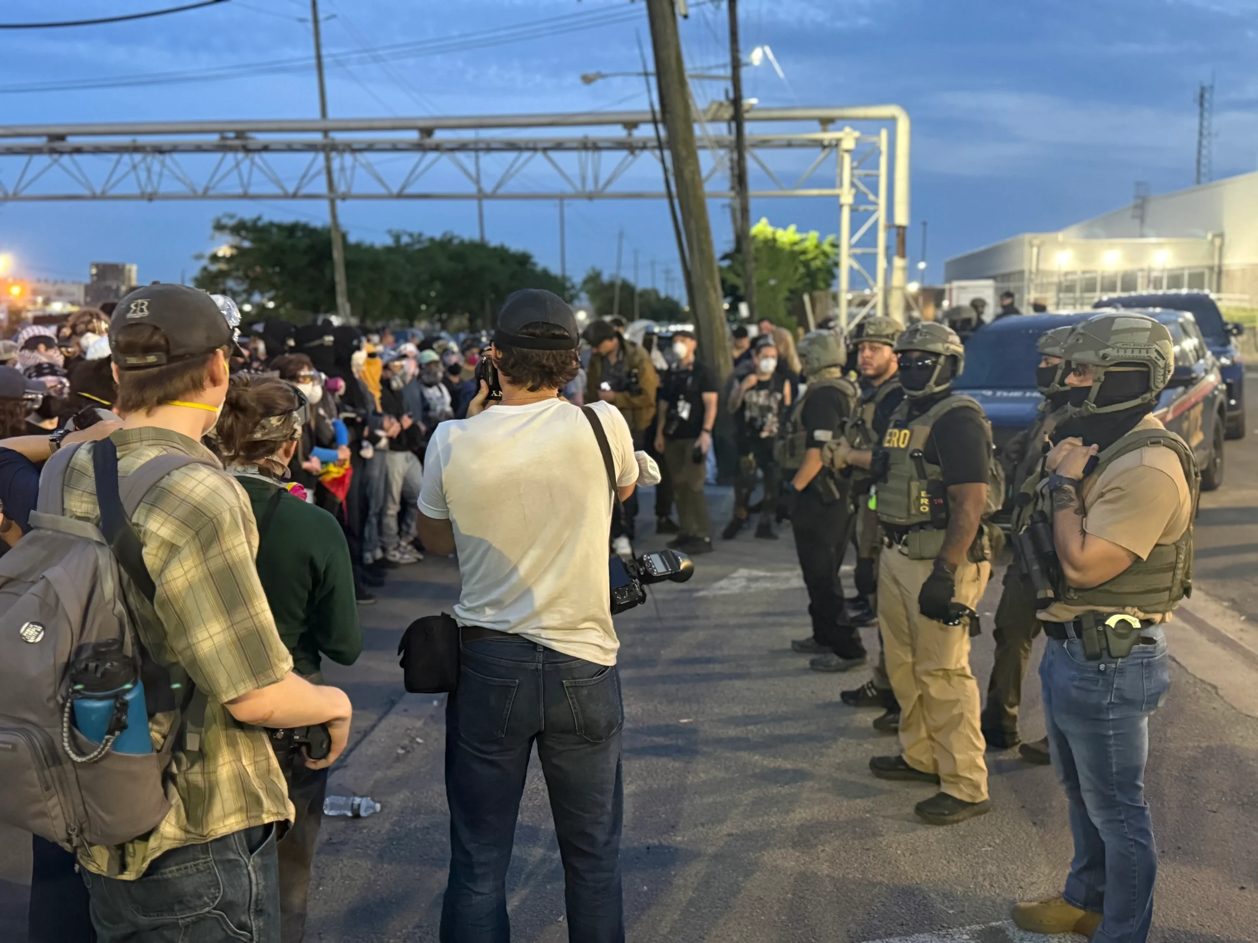 Protesters and ICE agents outside Delaney Hall Wednesday evening. (Marisa Kabas)