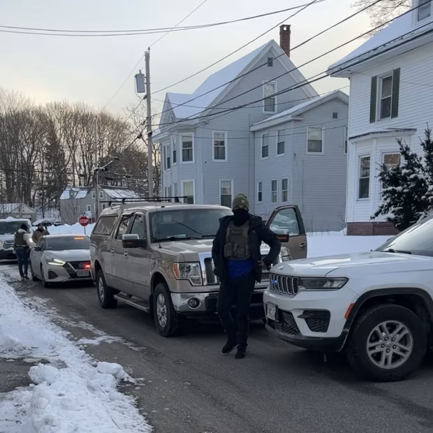Liz McLellan took this photo of federal immigration agents making an arrest on Jan. 21 in Westbrook, Maine. Then an agent held up his phone to McLellan’s face. Agents went to McLellan’s house not long after. Liz McLellan