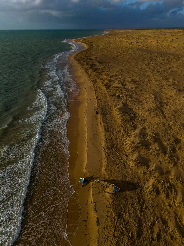 The remains of a burned boat near Puerto López, Guajira, Colombia in December.Credit...Federico Rios for The New York Times