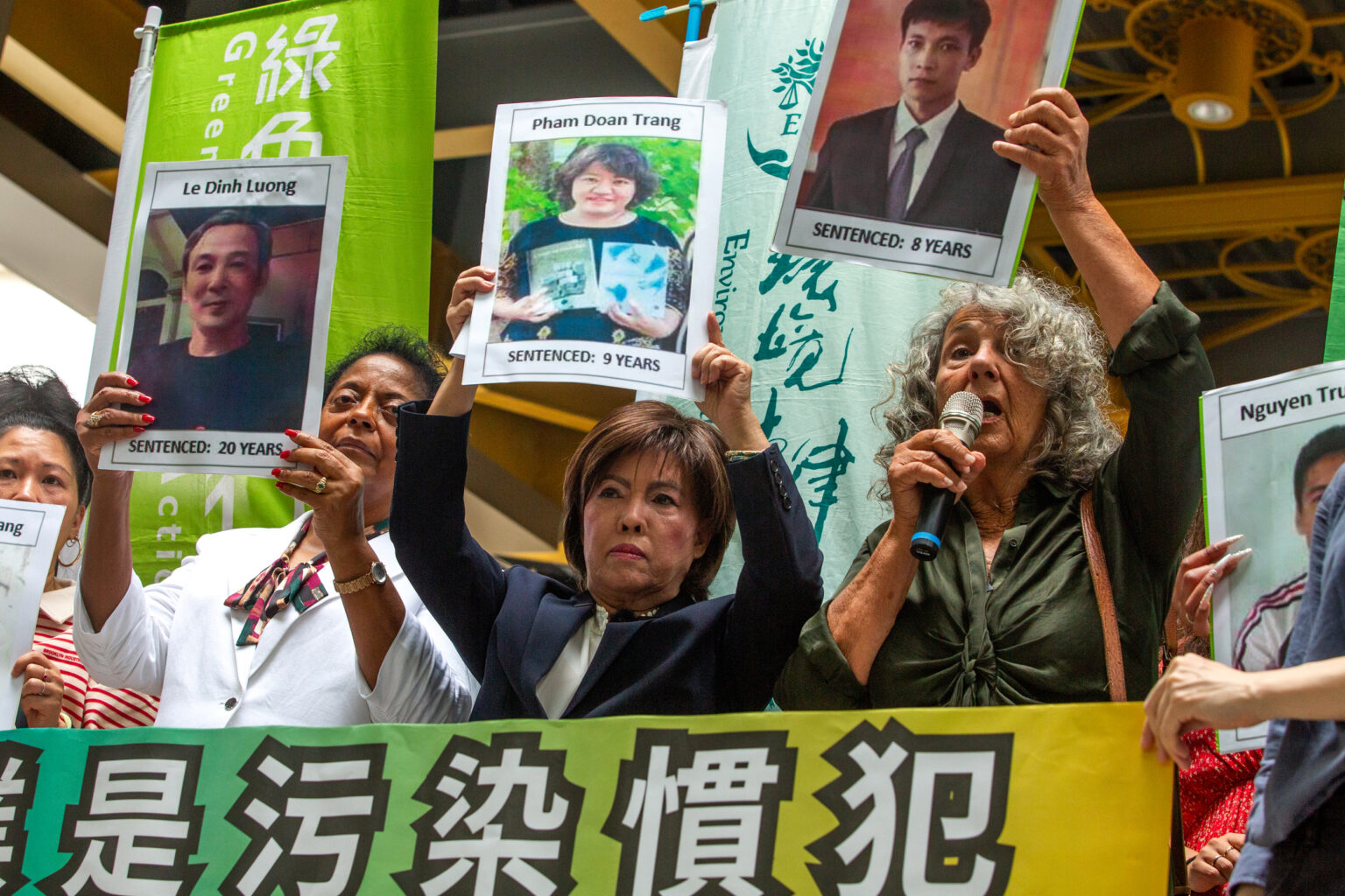 Diane Wilson (right), Sharon Lavigne (left) and Nancy Bui display pictures of Vietnamese activists jailed for demanding reparations over the Formosa Plastics’ 2016 chemical spill disaster on May 28 in Taipei. Credit: Dylan Baddour/Inside Climate News Diane Wilson (right), Sharon Lavigne (left) and Nancy Bui display pictures of Vietnamese activists jailed for demanding reparations over the Formosa Plastics’ 2016 chemical spill disaster on May 28 in Taipei. Credit: Dylan Baddour/Inside Climate News