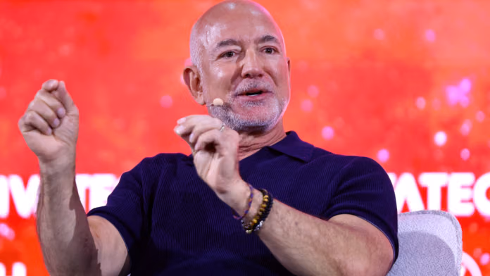 Jeff Bezos, founder of Amazon and Blue Origin, and co-founder and co-CEO of Prometheus, gestures as he speaks during the 10th edition of the VivaTech fair in Paris, on 17 June 2026 | Abdul Saboor | Reuters