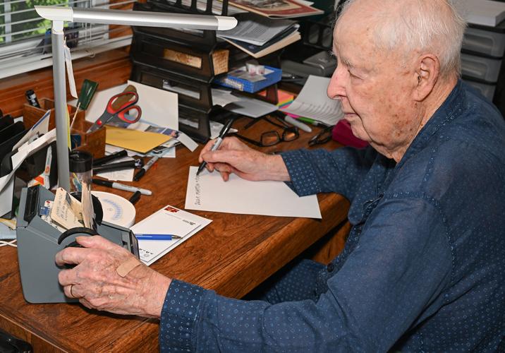 Mel West sits down to write on June 17 in his home office in Columbia, which he does every morning as a part of his routine. “I urge everyone as they are getting older to write their memoirs,” West said. “So many people don’t know their family history.” [I still receive handwritten mail from Mel.]