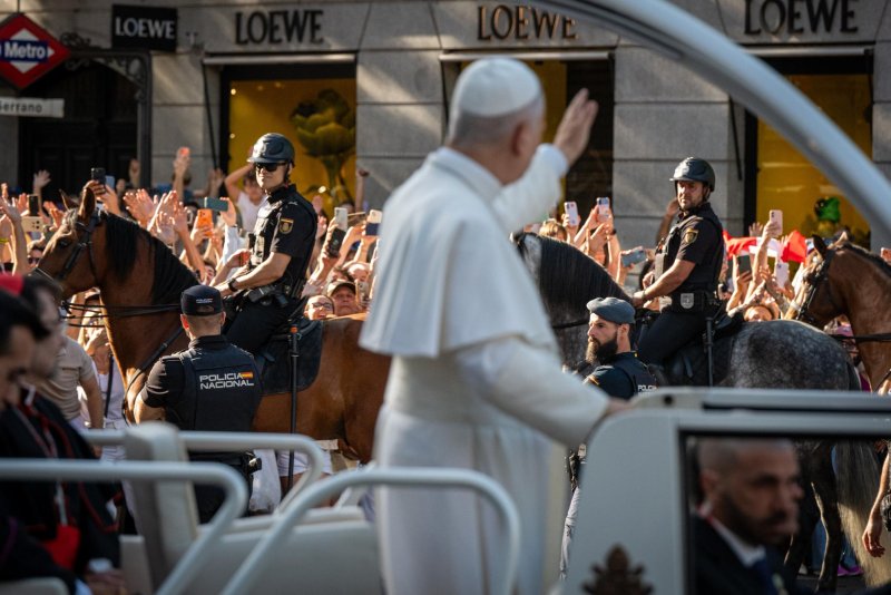 Pope Leo XIV greets the people from the popemobile after presiding over the meeting 