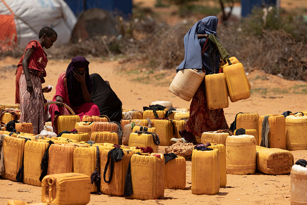 Displaced people collect water from a well inside a camp for internally displaced persons in the outskirts of Kismayo, Somalia, on April 21, 2026.Simon Maina / AFP via Getty Images