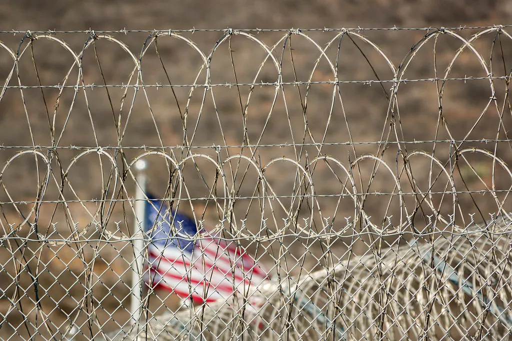 barbed wire fence (Photo by Kevin Carter/Getty Images) barbed wire fence (Photo by Kevin Carter/Getty Images)