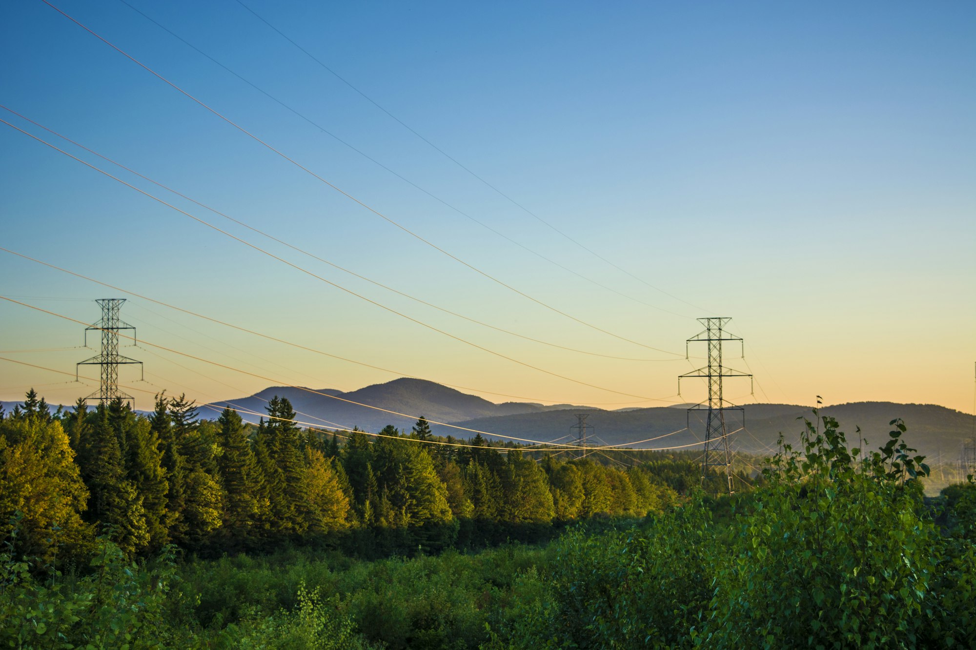 power transmission lines Photo by Jaël Vallée / Unsplash